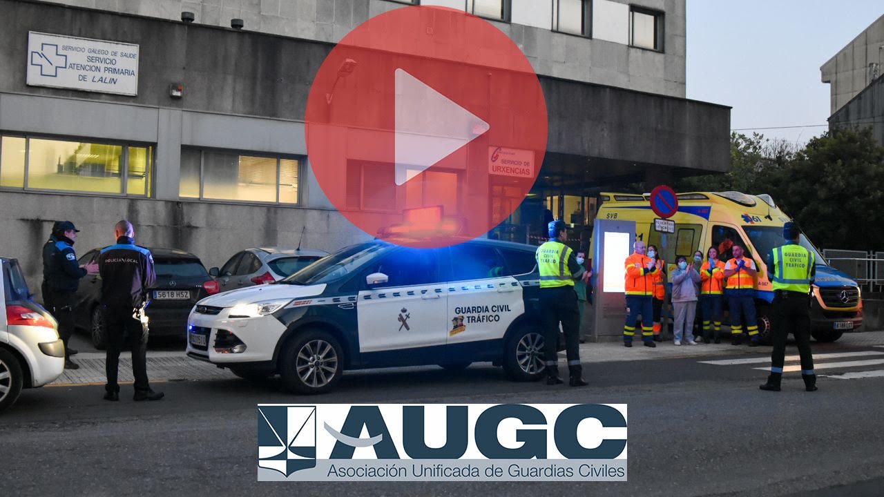 Guardias civiles, policías y sanitarios se aplauden ante un centro de salud en Galicia.